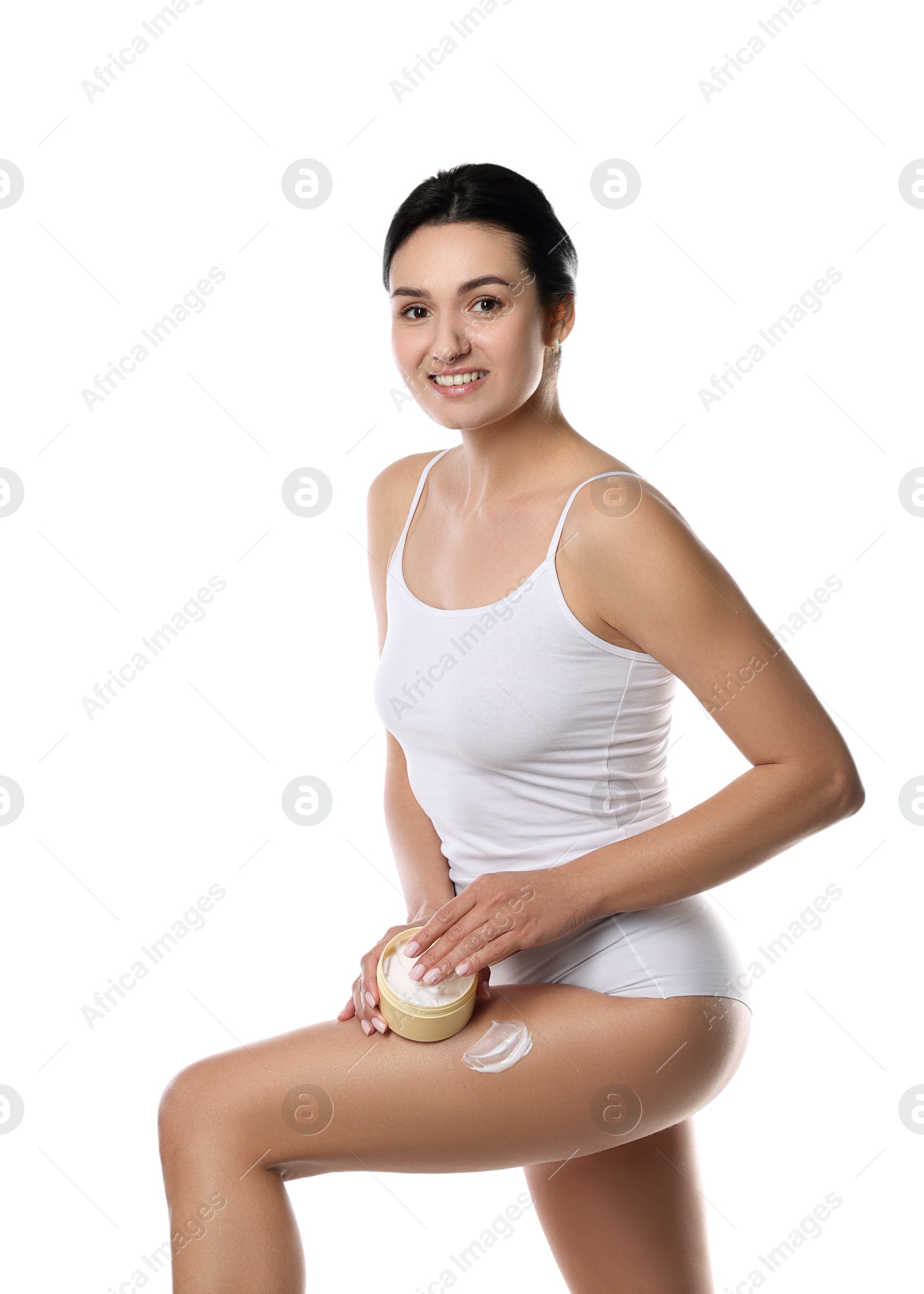 Photo of Woman applying anti cellulite cream on white background