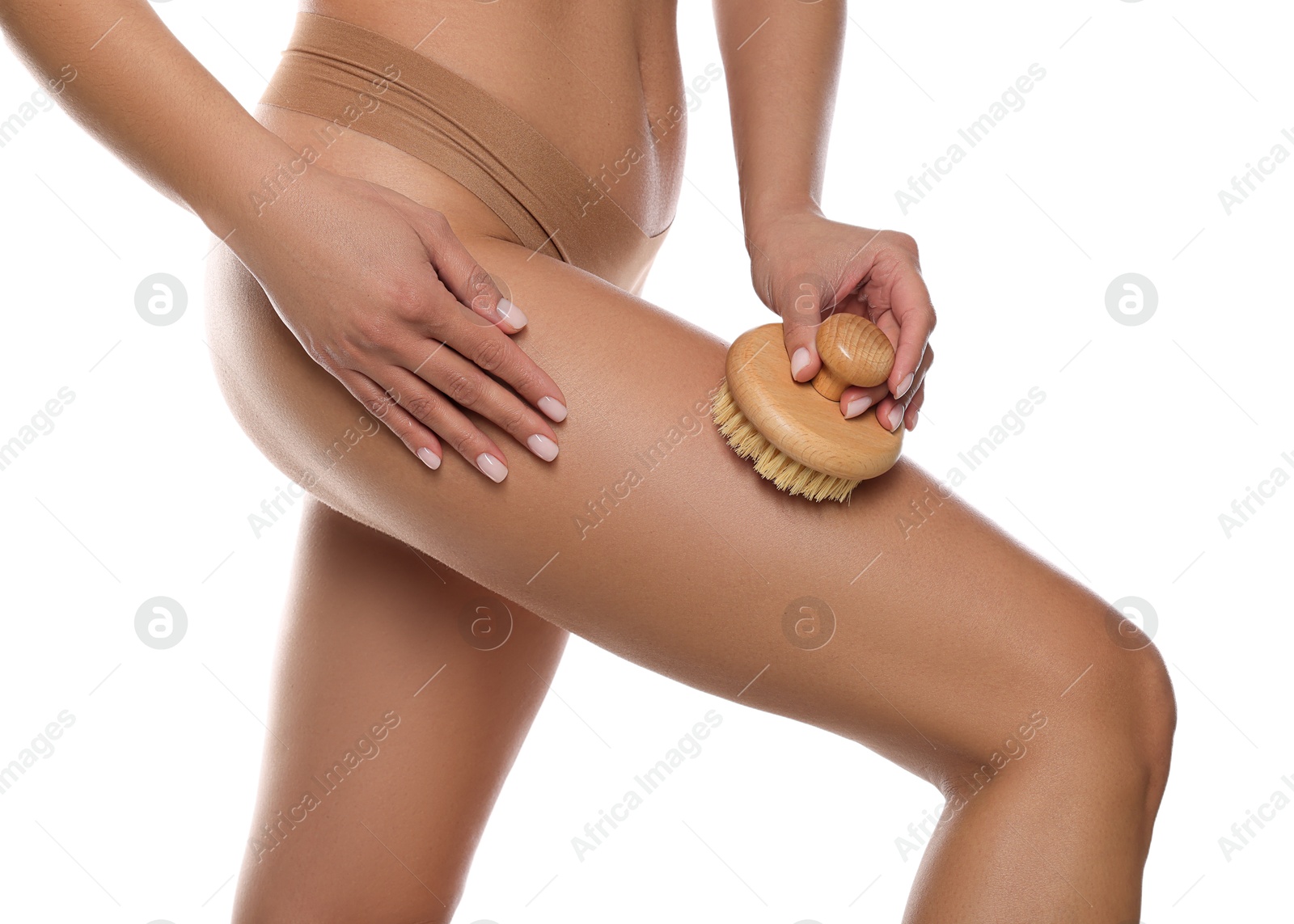 Photo of Woman doing anti cellulite massage with brush on white background, closeup