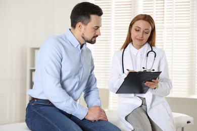 Photo of Man having appointment with cardiologist in clinic