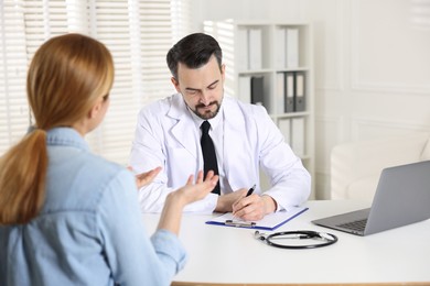 Photo of Woman having appointment with cardiologist in clinic