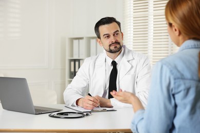 Photo of Woman having appointment with cardiologist in clinic