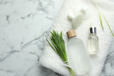 Photo of Spa composition with wheatgrass on white marble background, top view. Space for text