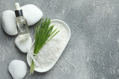 Spa composition with wheatgrass on grey background, flat lay. Space for text