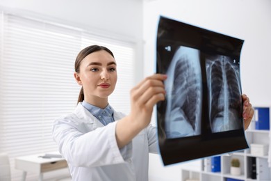 Doctor examining x-ray of lungs in hospital