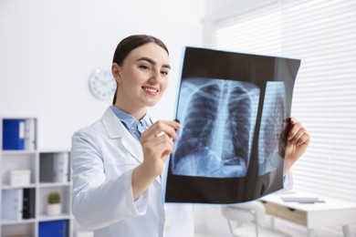 Photo of Doctor examining x-ray of lungs in hospital