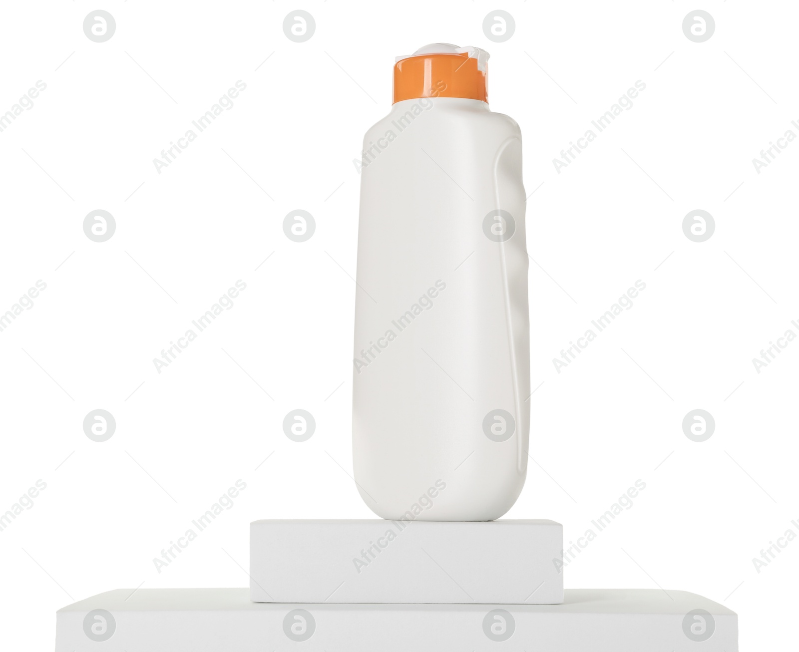 Photo of Bottle of sun protection product on podium against white background