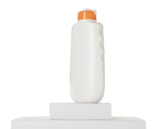 Photo of Bottle of sun protection product on podium against white background