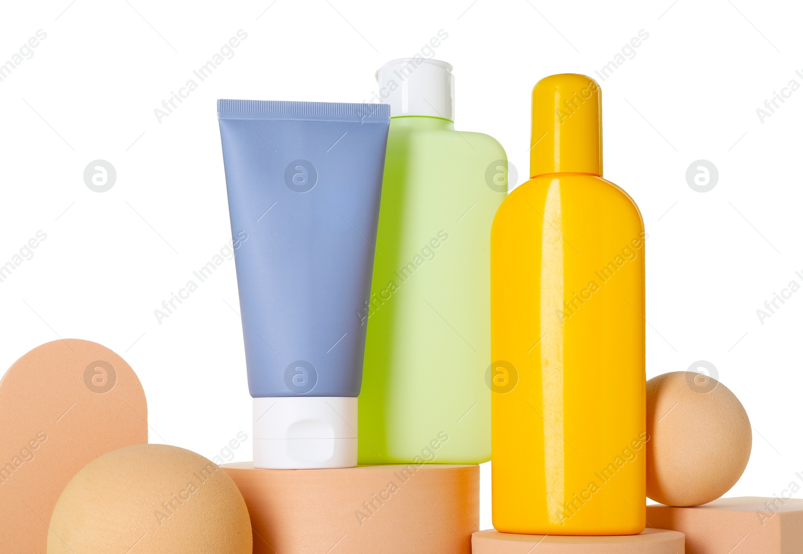 Photo of Different sun protection products on podiums against white background