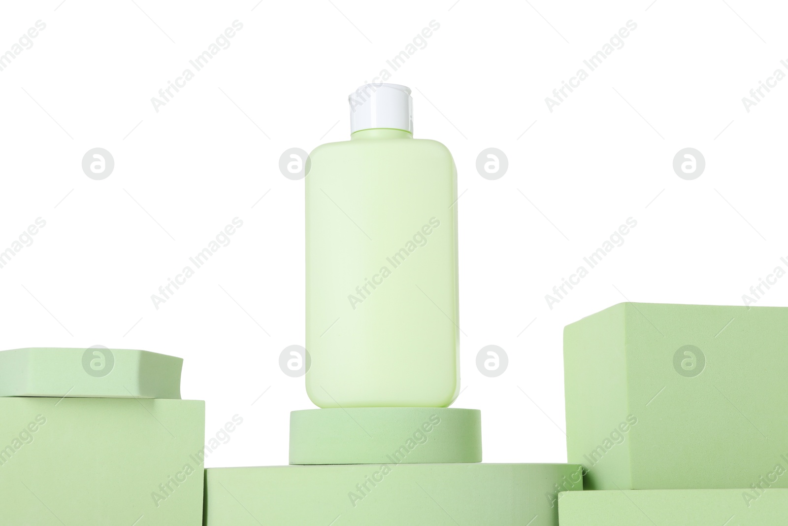 Photo of Bottle of sun protection product and podiums against white background