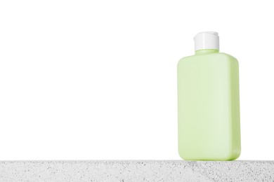 Photo of Bottle of sun protection product on concrete surface against white background