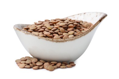 Photo of Raw lentils in bowl isolated on white