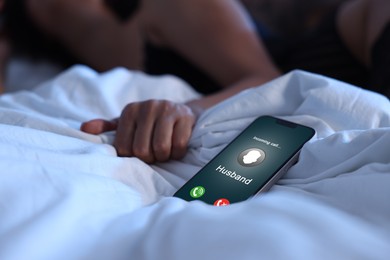 Image of Betrayal. Husband calling his wife on phone, while she spending time with other man on bed, selective focus