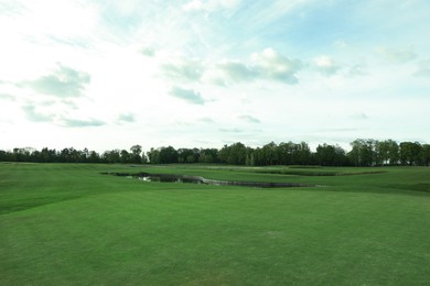 Photo of Beautiful view of golf course on sunny day