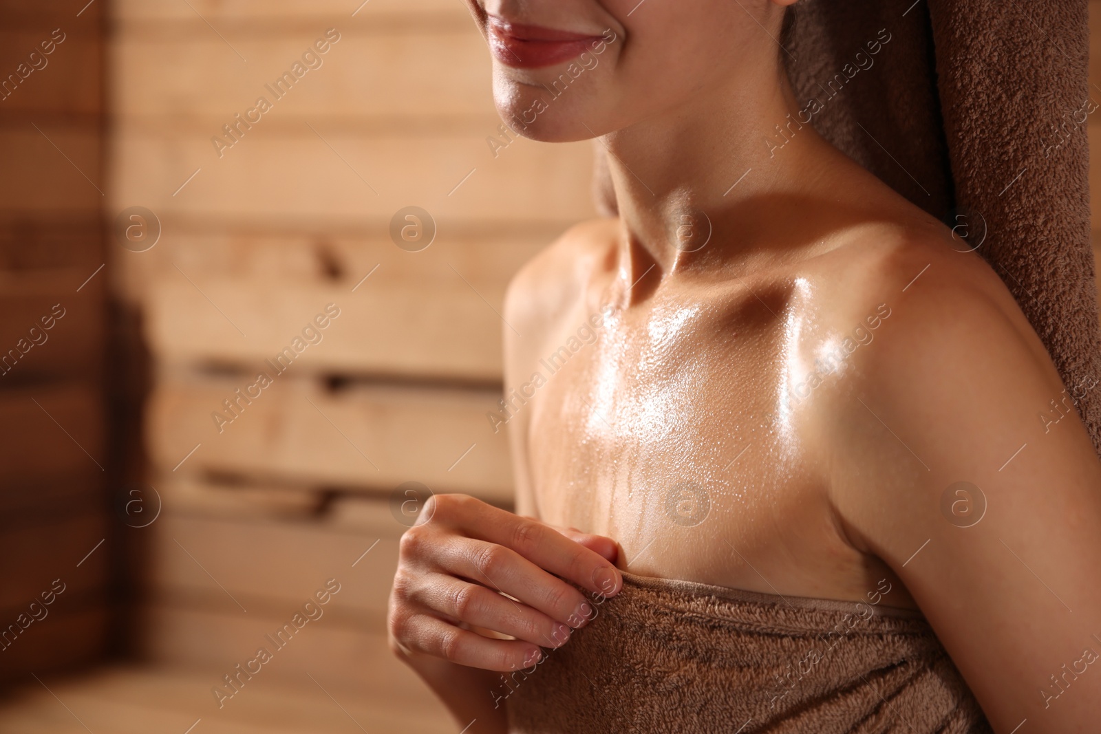 Photo of Beautiful woman in hot sauna, closeup. Space for text