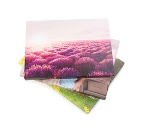 Canvas with different printed photos isolated on white, above view