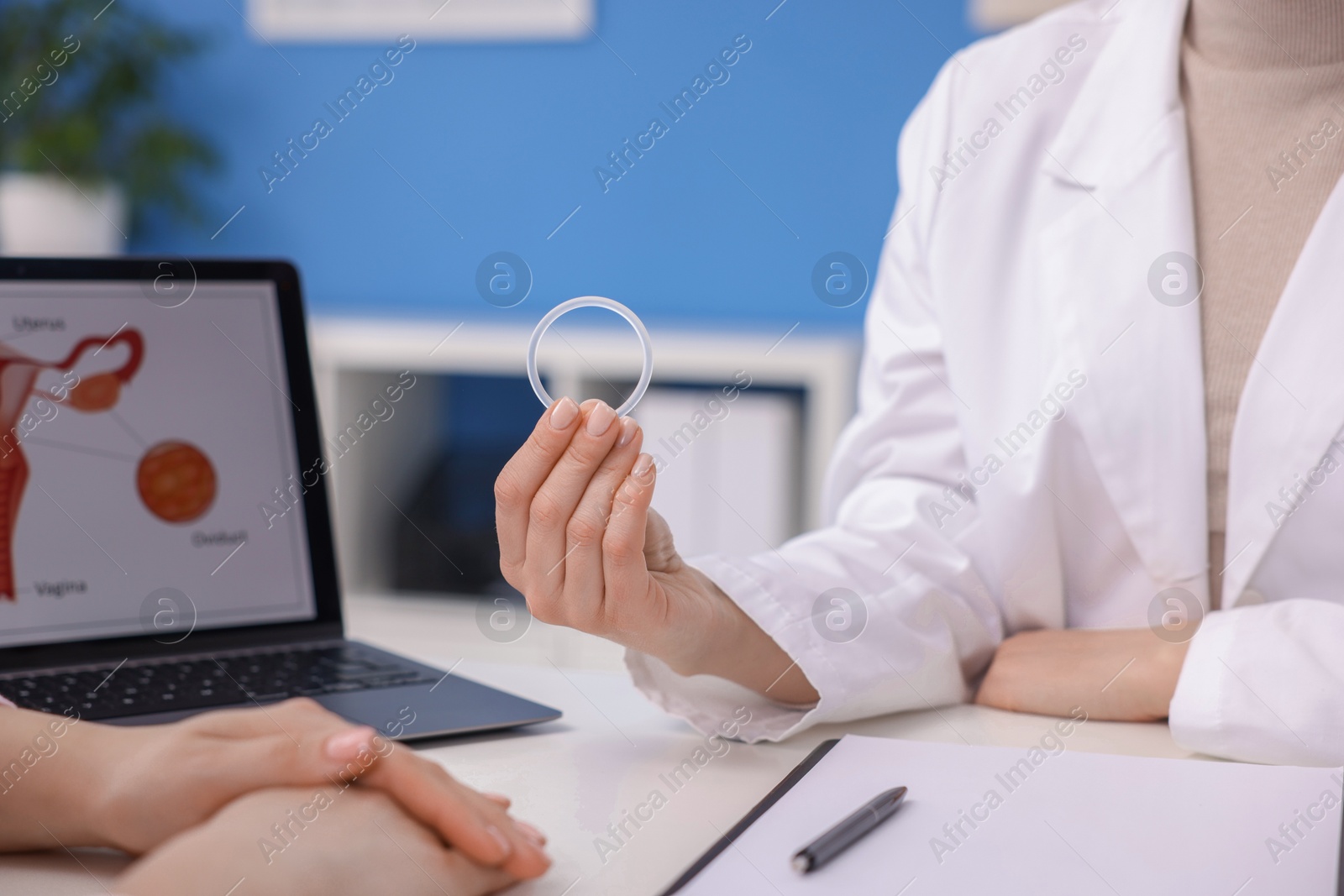 Photo of Contraception. Gynecologist recommending vaginal ring to woman in clinic, closeup