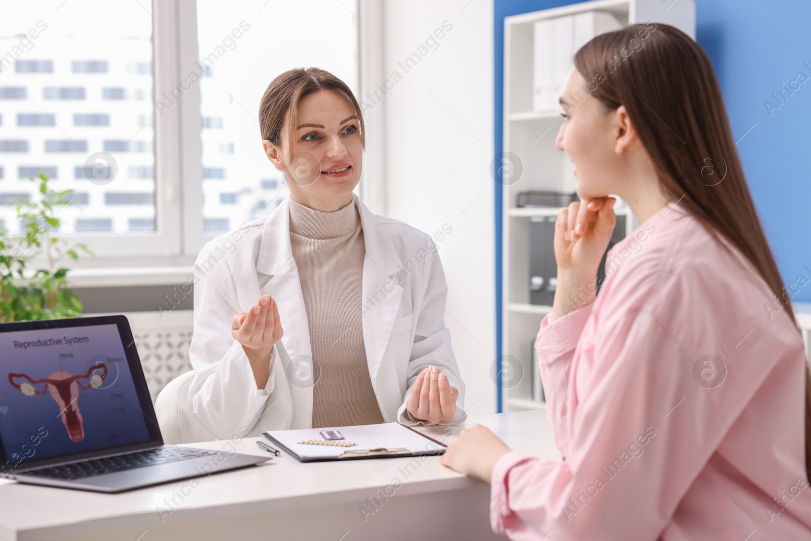 Photo of Contraception. Woman having appointment with gynecologist in clinic