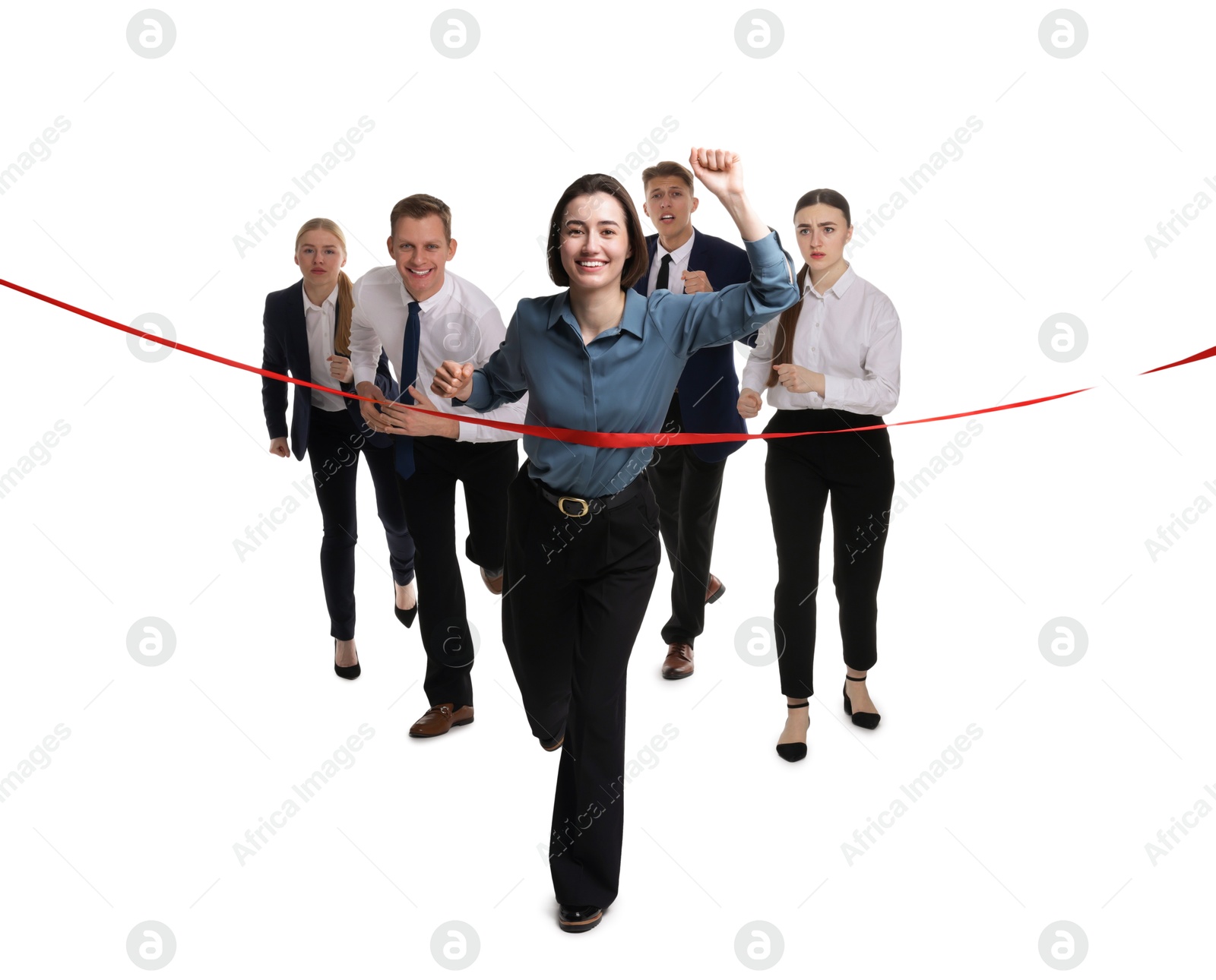 Photo of Competition concept. Happy businesswoman crossing red finish line ahead of her colleagues on white background