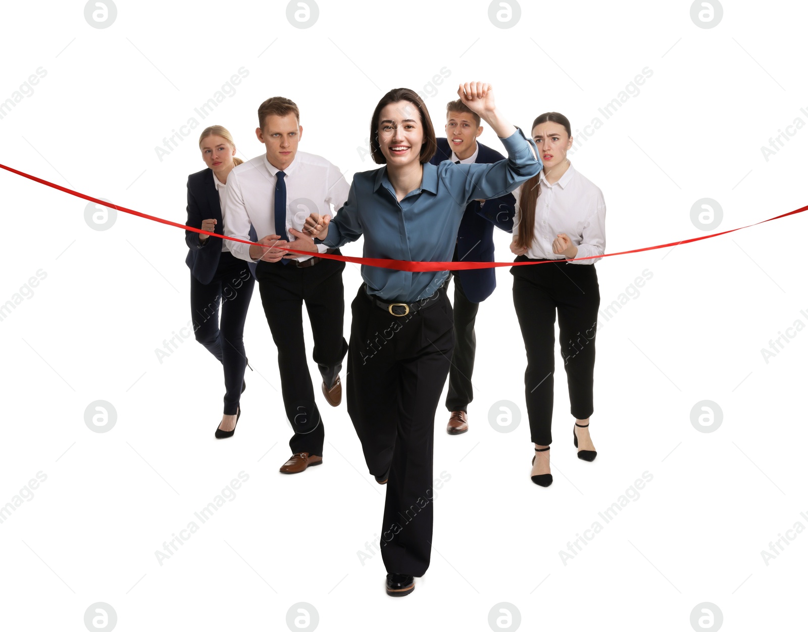 Photo of Competition concept. Happy businesswoman crossing red finish line ahead of her colleagues on white background