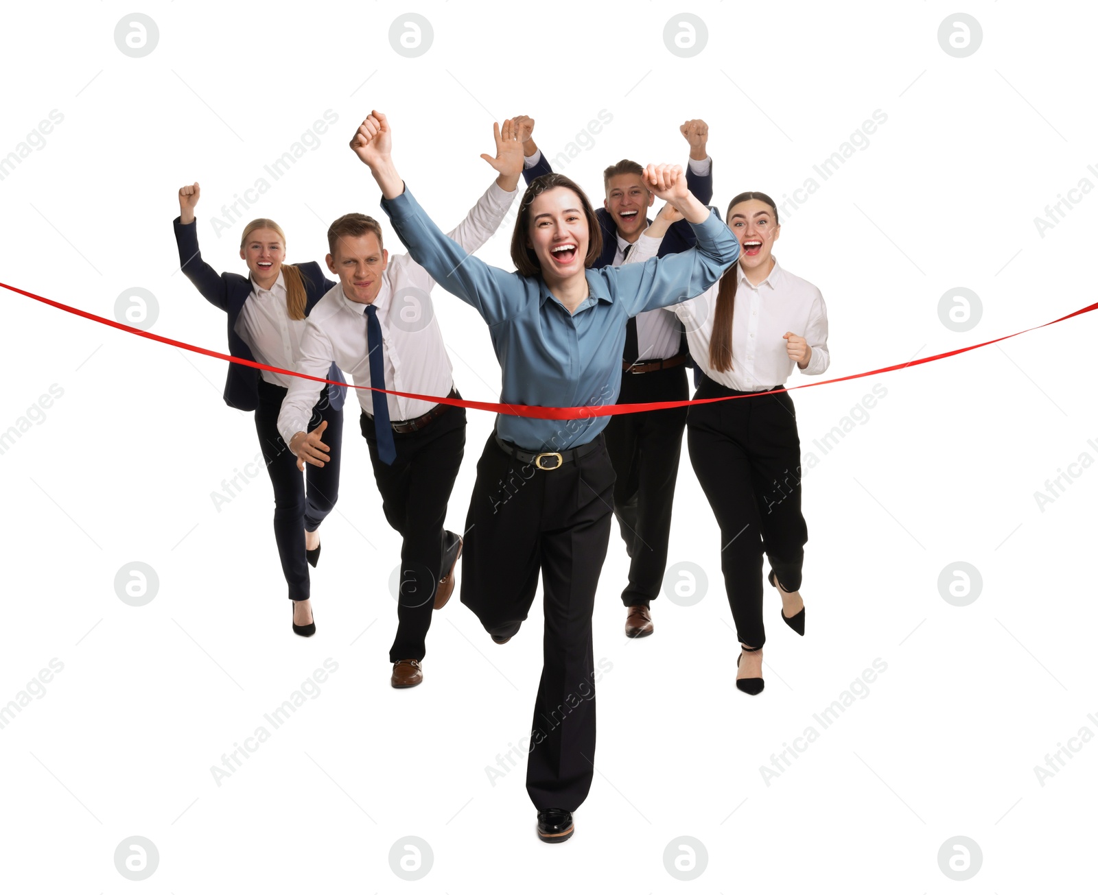 Photo of Competition concept. Happy businesswoman crossing red finish line ahead of her colleagues on white background