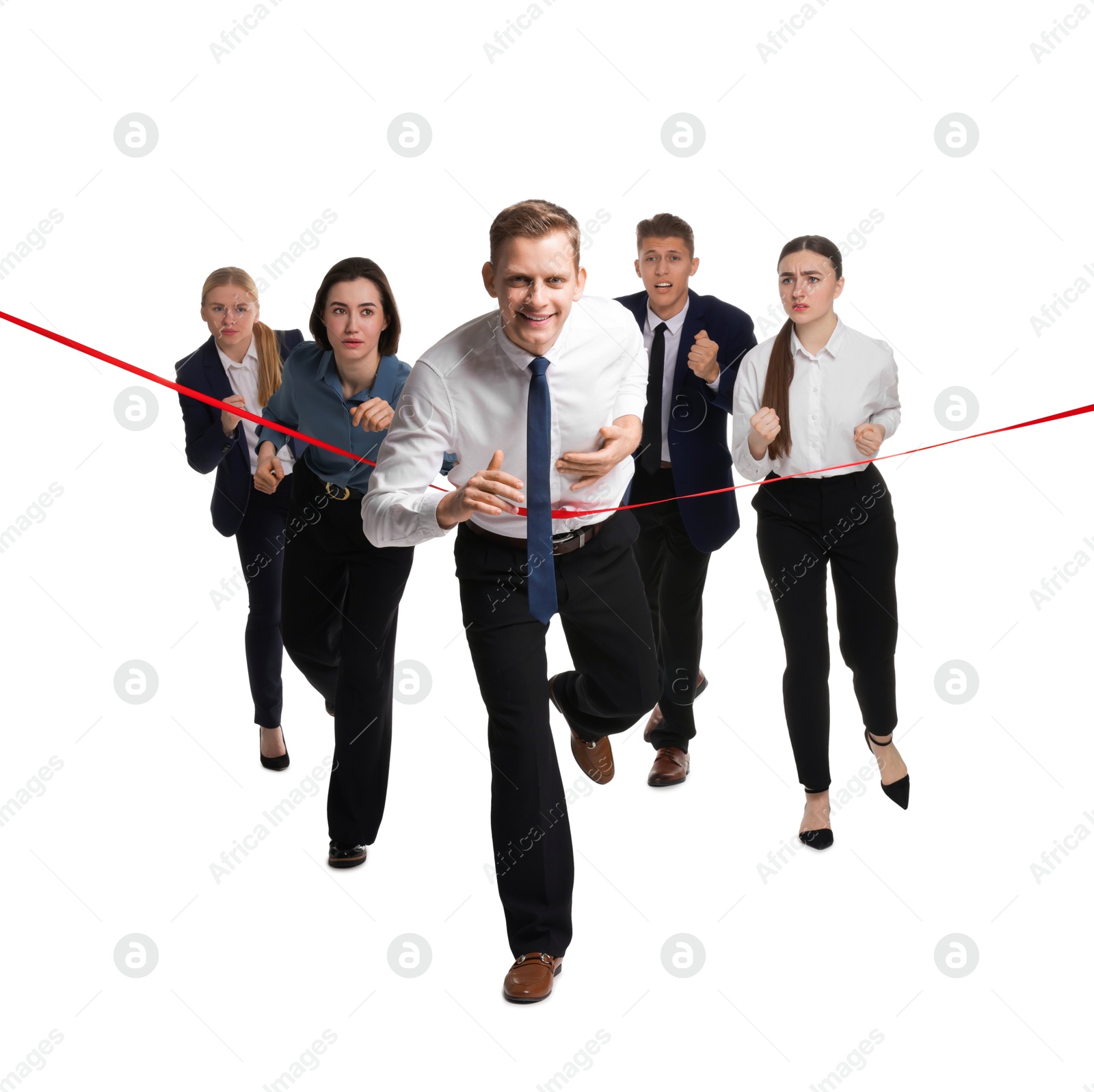 Photo of Competition concept. Happy businessman crossing red finish line ahead of his colleagues on white background