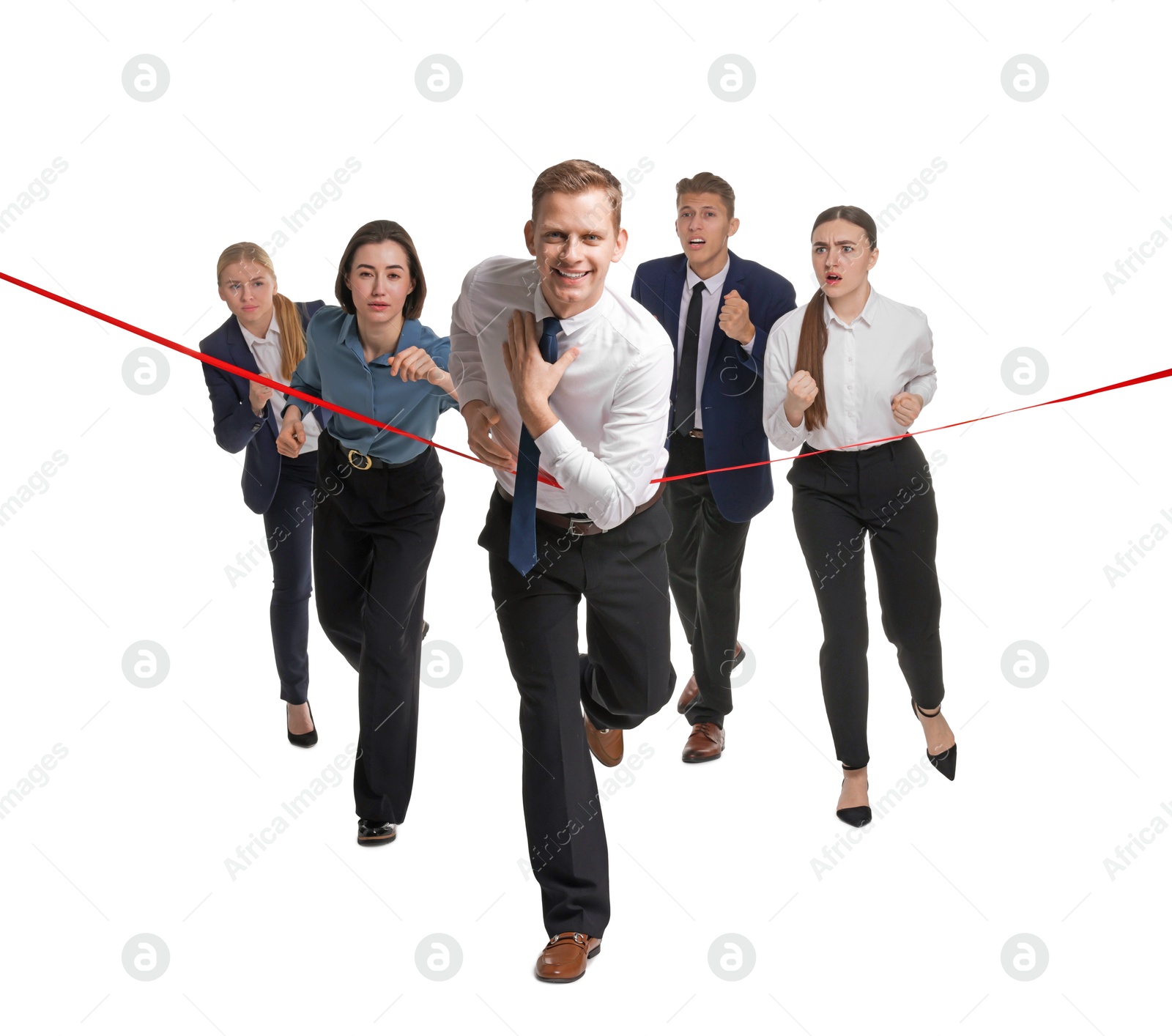 Photo of Competition concept. Happy businessman crossing red finish line ahead of his colleagues on white background