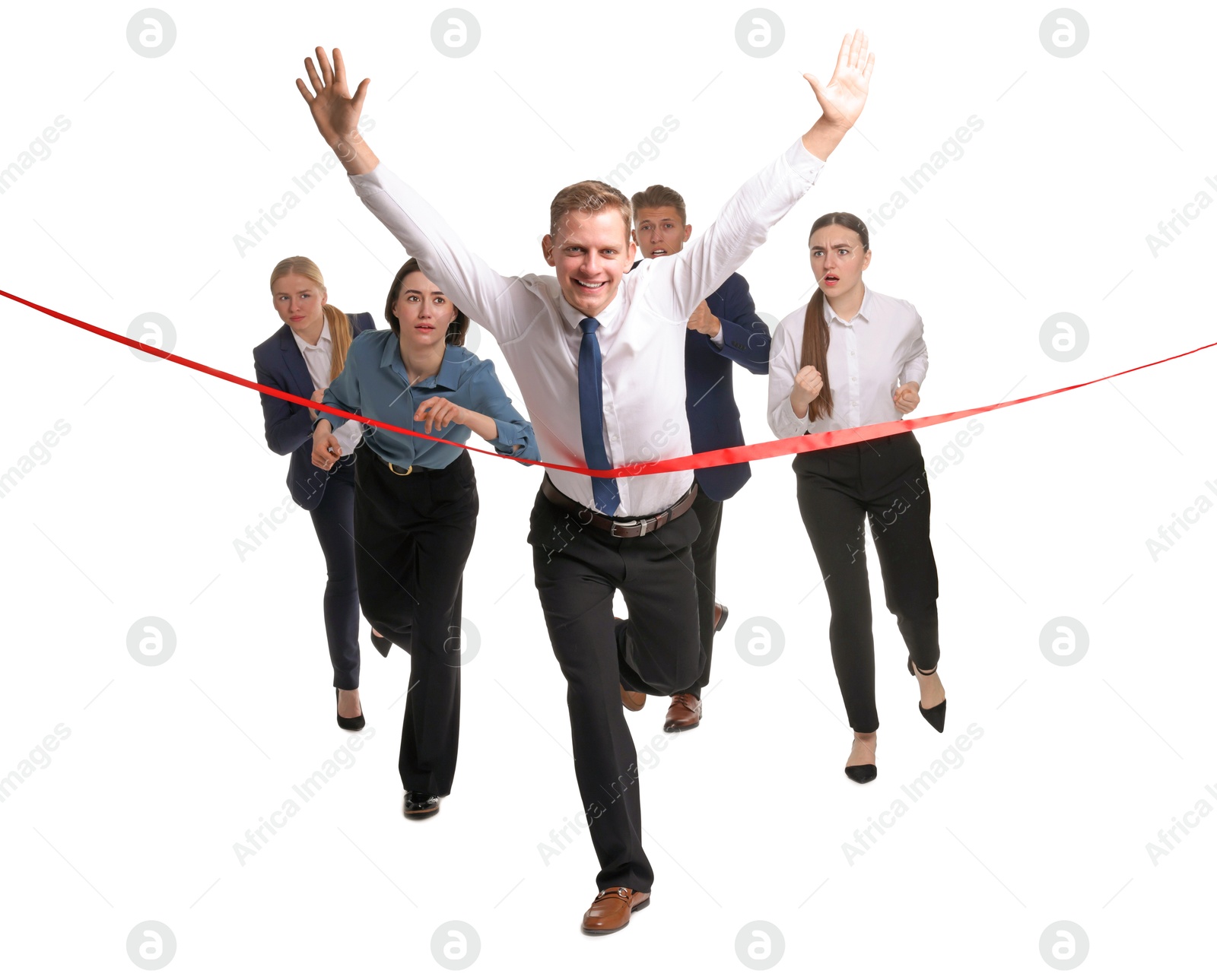 Photo of Competition concept. Happy businessman crossing red finish line ahead of his colleagues on white background