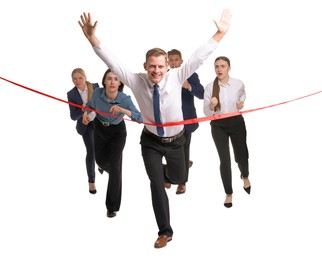 Competition concept. Happy businessman crossing red finish line ahead of his colleagues on white background