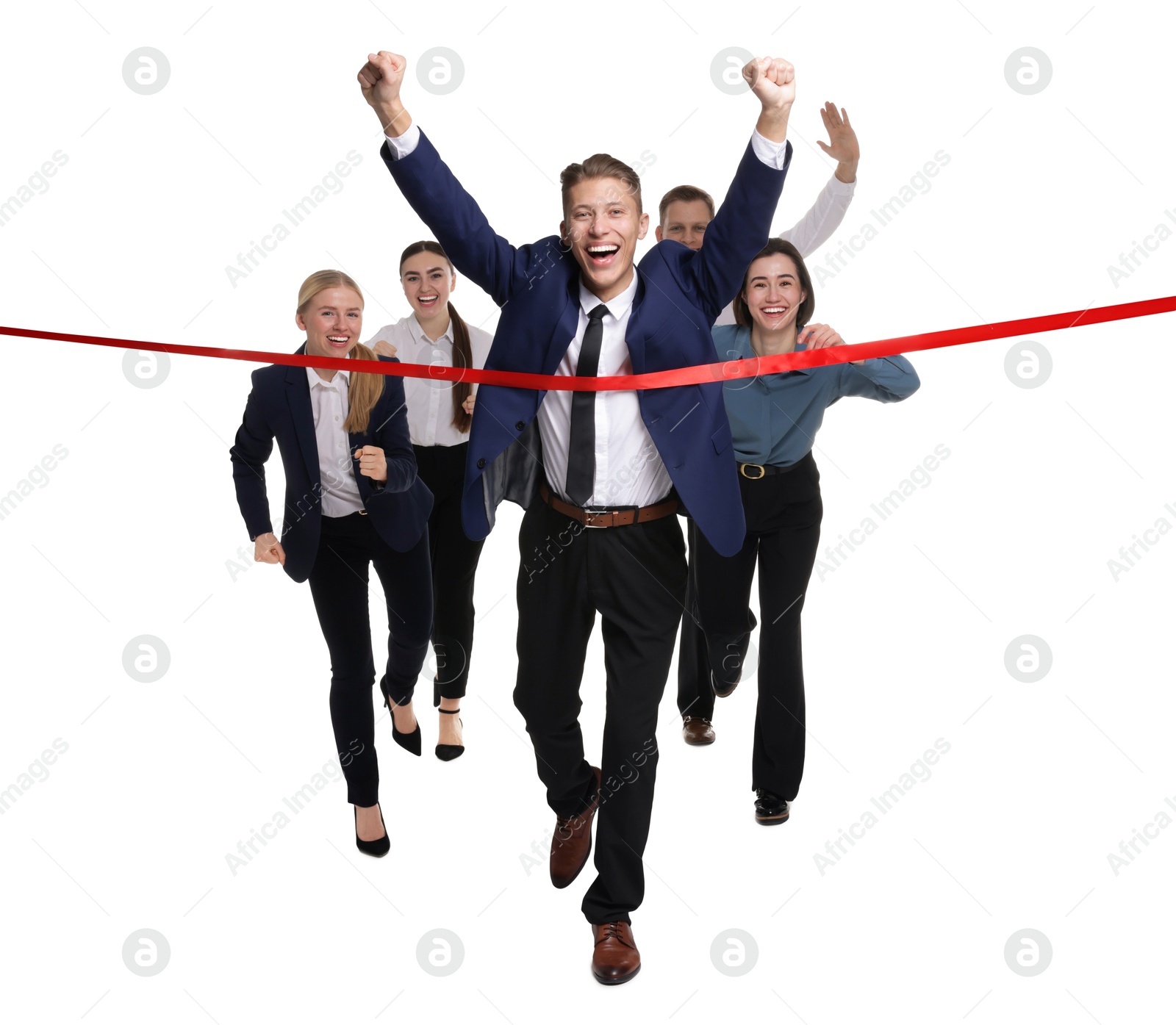 Photo of Competition concept. Happy businessman crossing red finish line ahead of his colleagues on white background