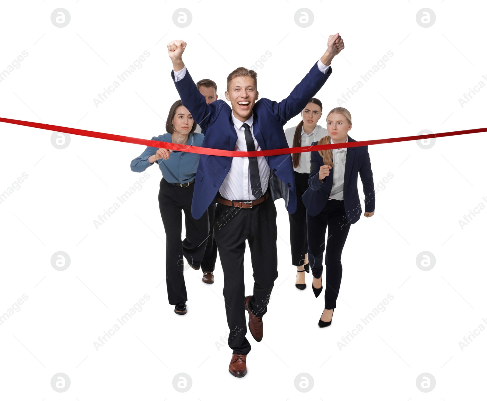 Photo of Competition concept. Happy businessman crossing red finish line ahead of his colleagues on white background