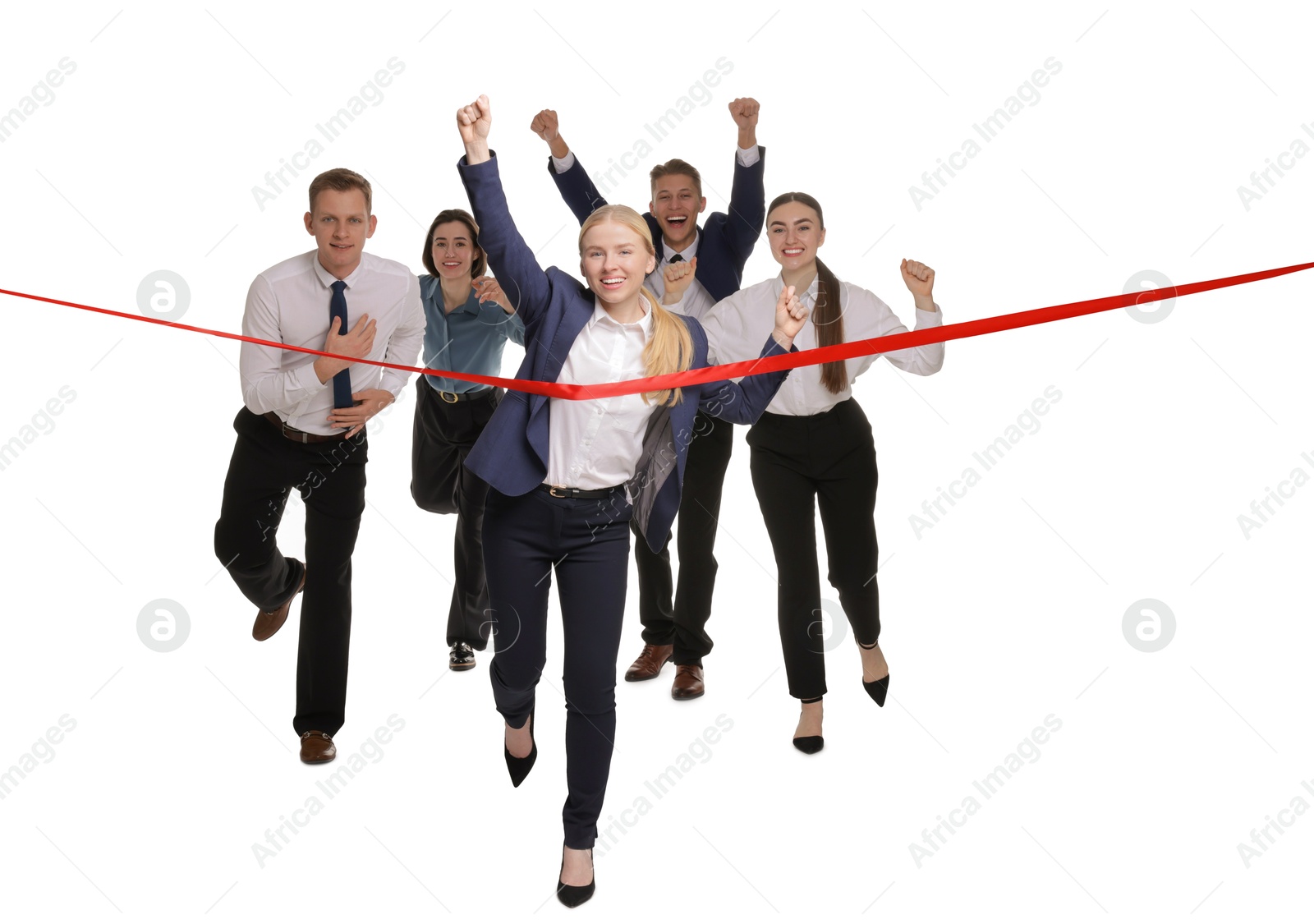 Photo of Competition concept. Happy businesswoman crossing red finish line ahead of her colleagues on white background