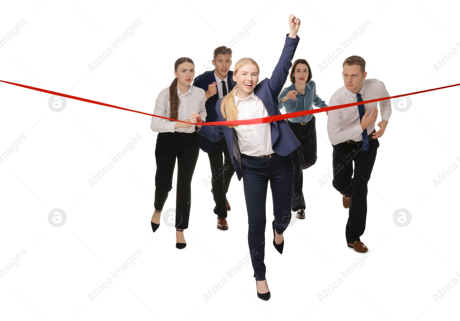 Photo of Competition concept. Happy businesswoman crossing red finish line ahead of her colleagues on white background