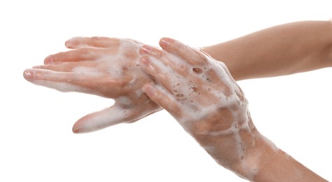 Photo of Woman washing hands with foaming soap on white background, closeup. Hygiene