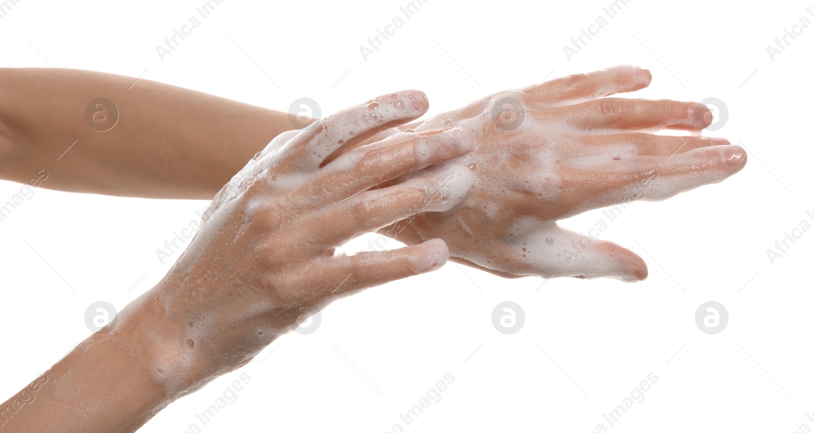 Photo of Woman washing hands with foaming soap on white background, closeup. Hygiene