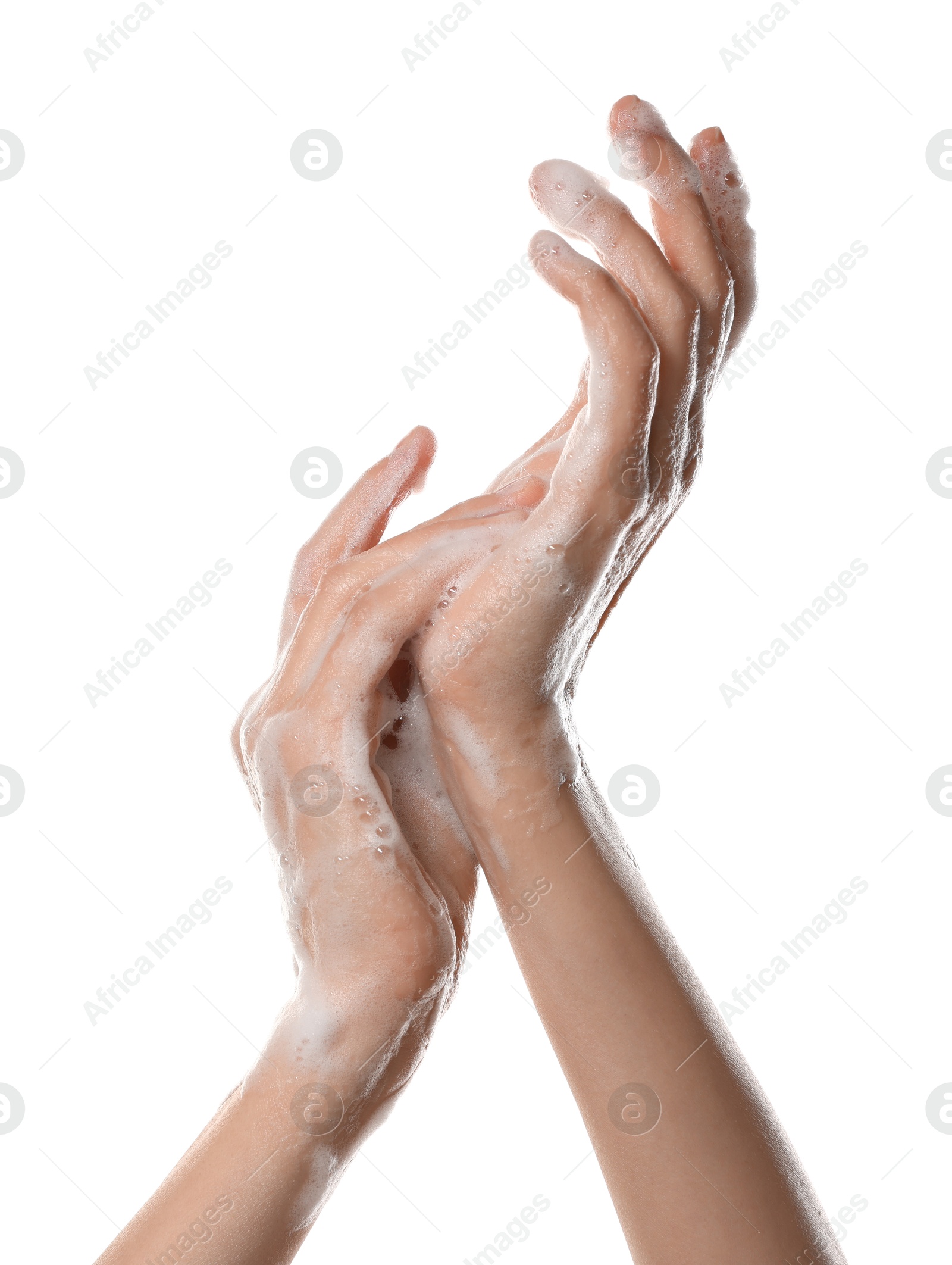 Photo of Woman washing hands with foaming soap on white background, closeup. Hygiene