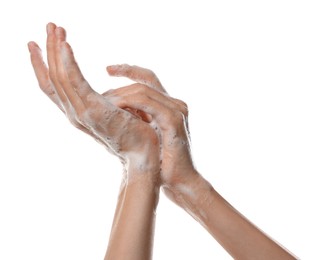 Photo of Woman washing hands with foaming soap on white background, closeup. Hygiene