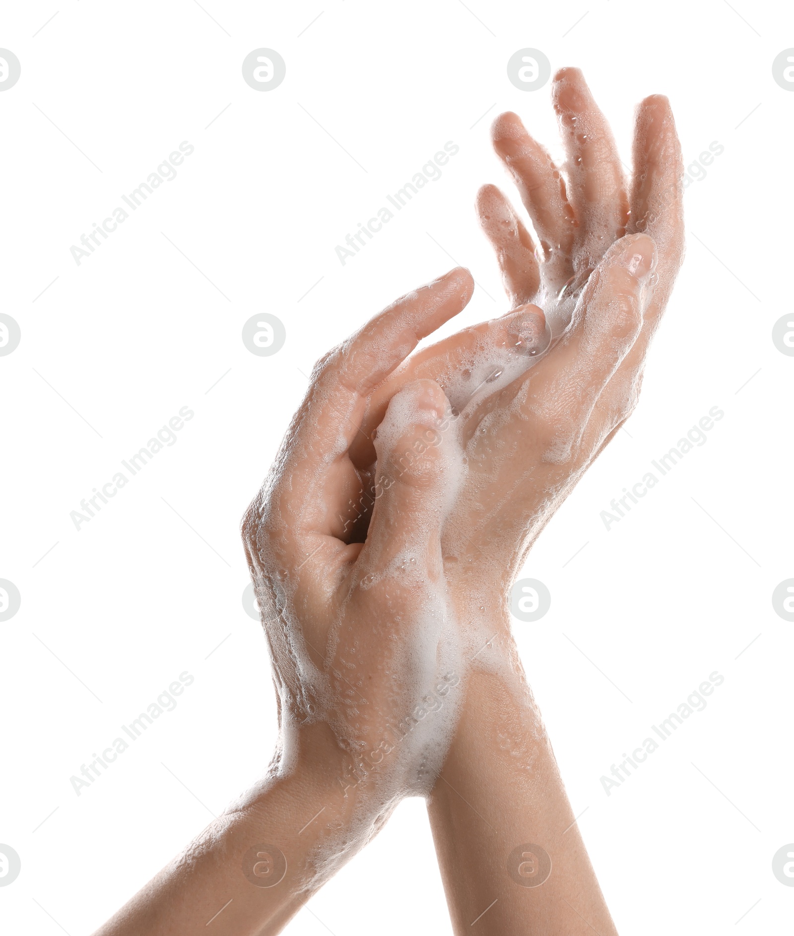 Photo of Woman washing hands with foaming soap on white background, closeup. Hygiene