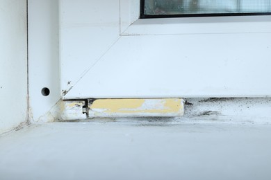 Photo of Window affected with black mold indoors, closeup view