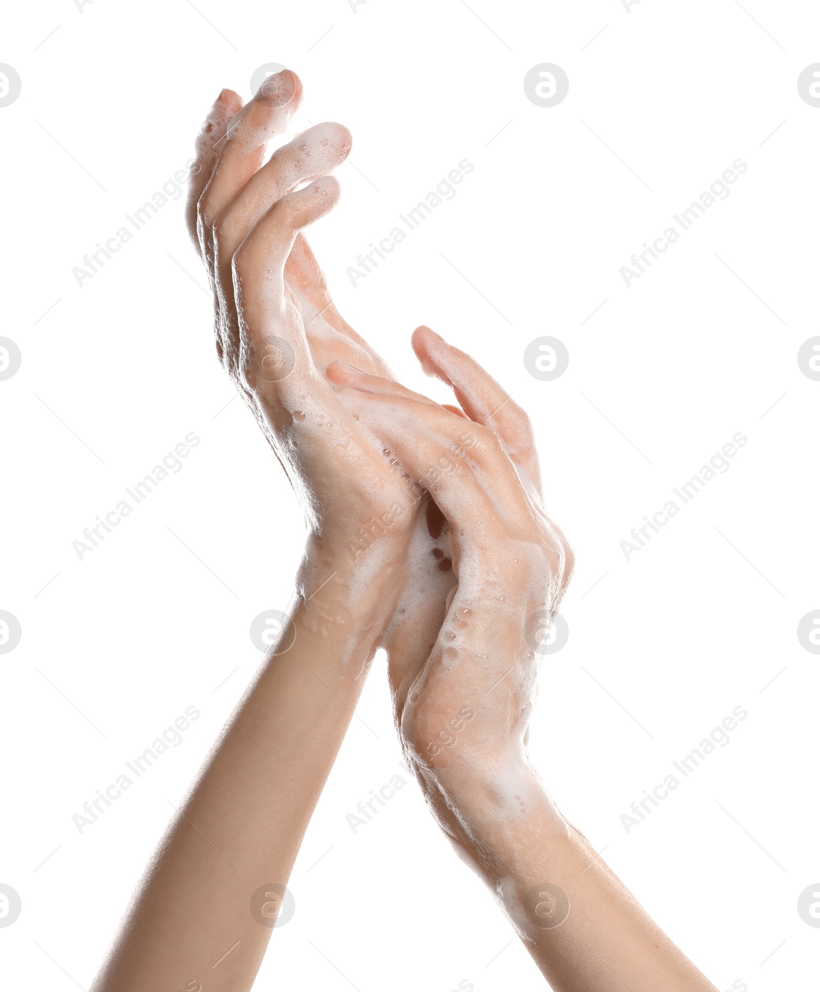 Photo of Woman washing hands with foaming soap on white background, closeup. Hygiene