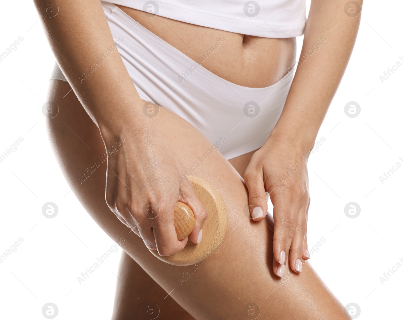 Photo of Woman doing anti cellulite massage with brush on white background, closeup