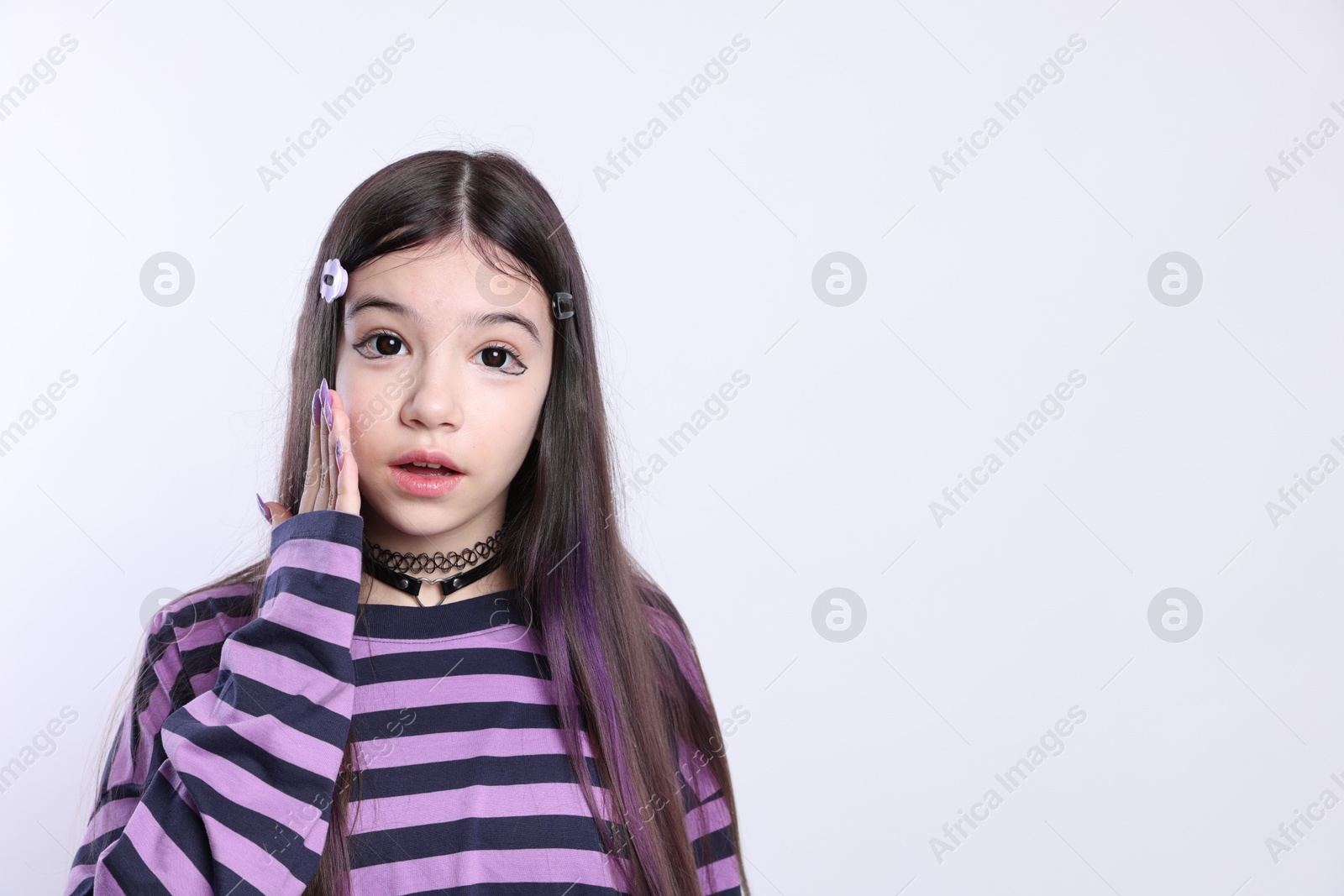 Photo of Teenage girl in stylish clothes and accessories posing on white background, space for text. Makeup in anime style