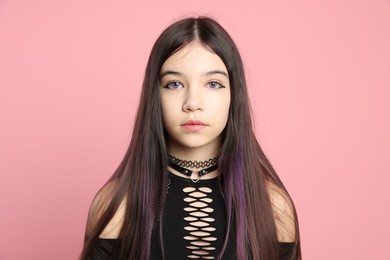 Teenage girl posing on pink background. Makeup and clothes in anime style