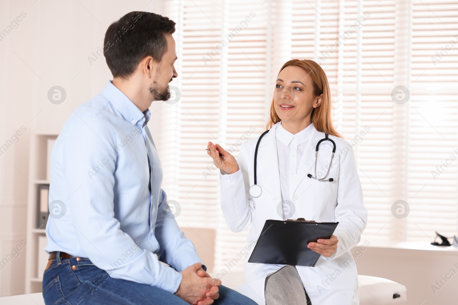 Photo of Man having appointment with cardiologist in clinic