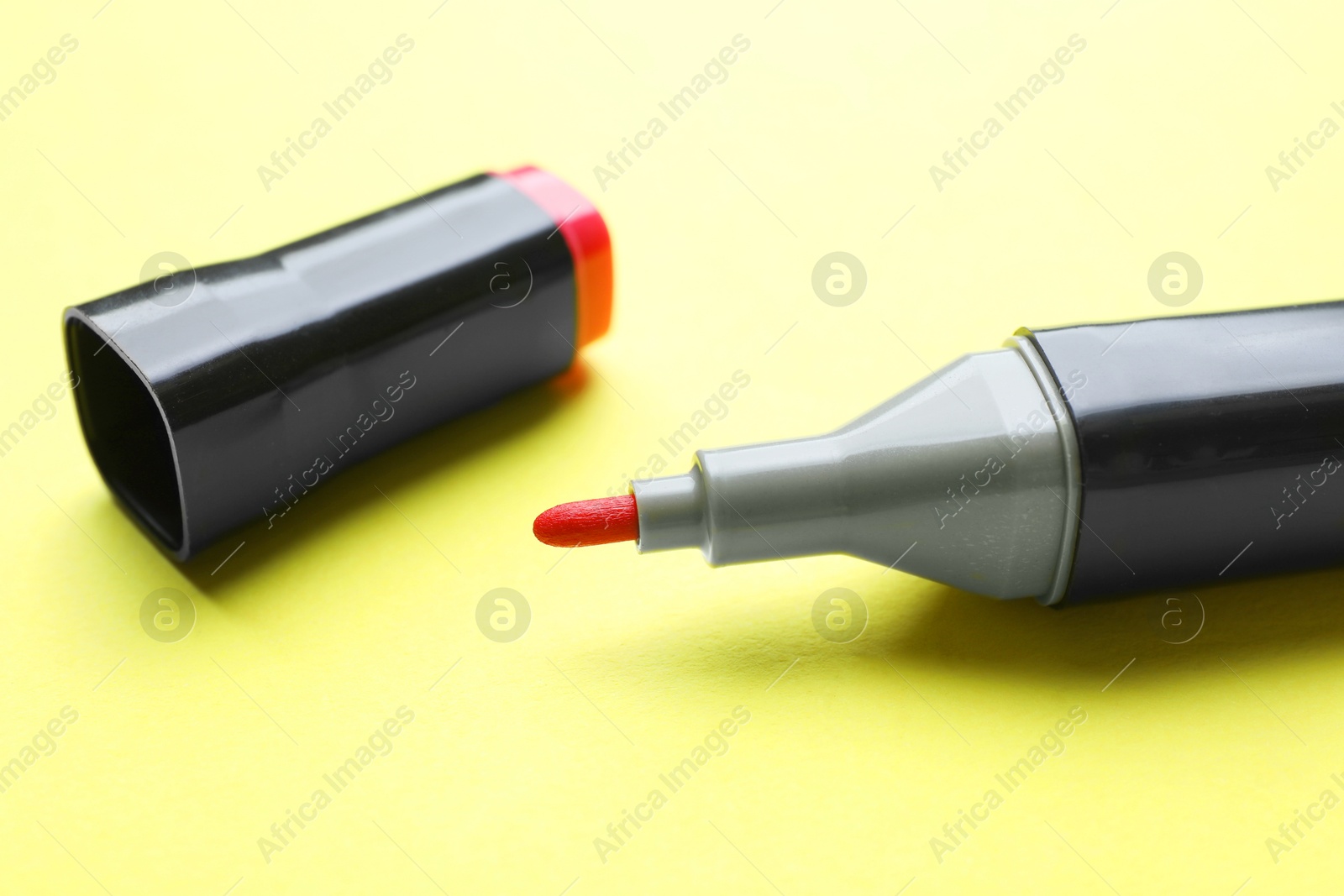 Photo of One color marker on yellow background, closeup