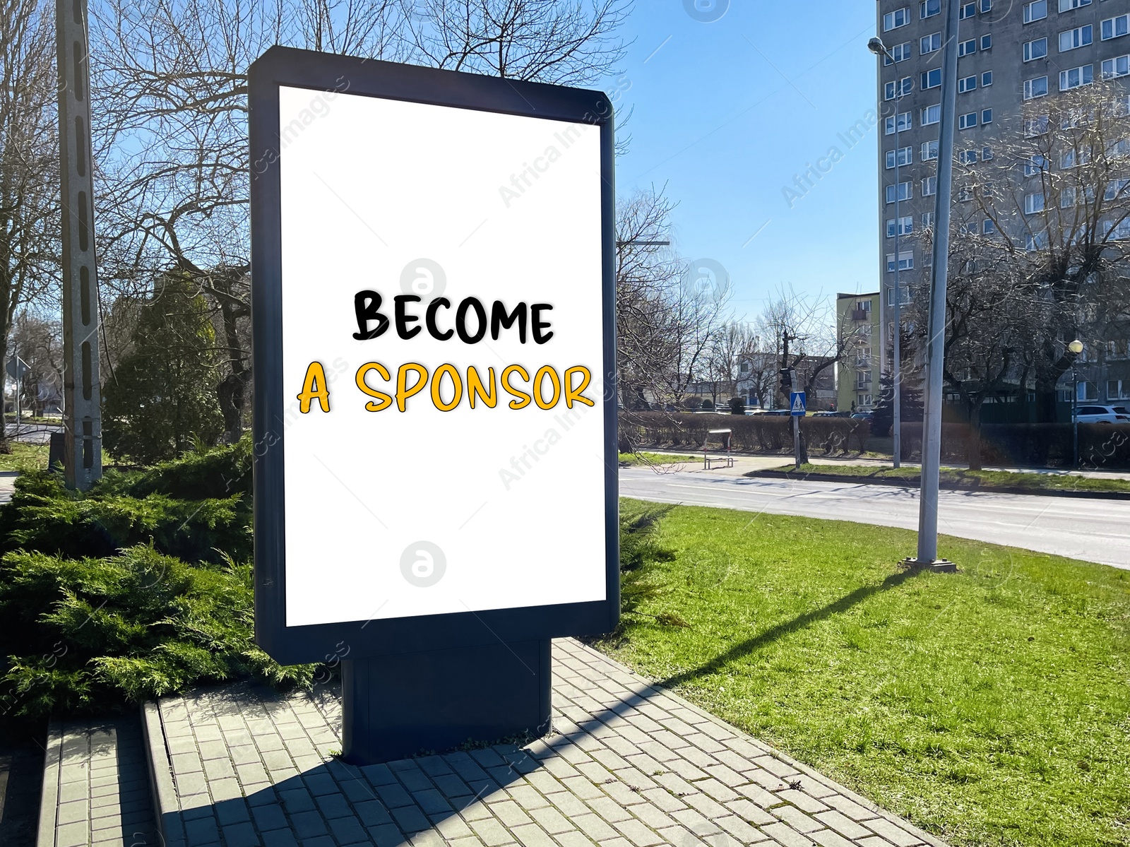 Image of Advertising board with text Become A Sponsor on city street