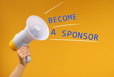 Image of Text Become A Sponsor coming out of megaphone in woman's hand on orange background