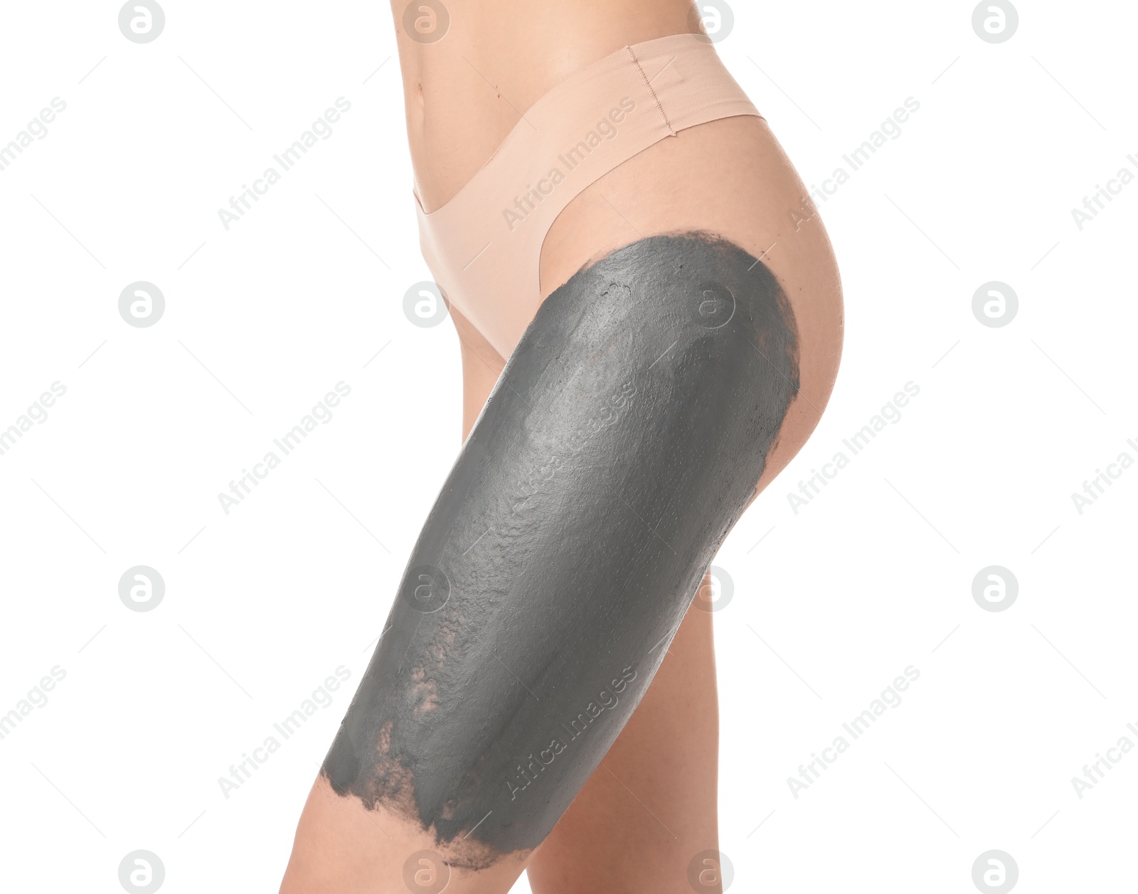 Photo of Woman doing spa body wraps on her leg against white background, closeup