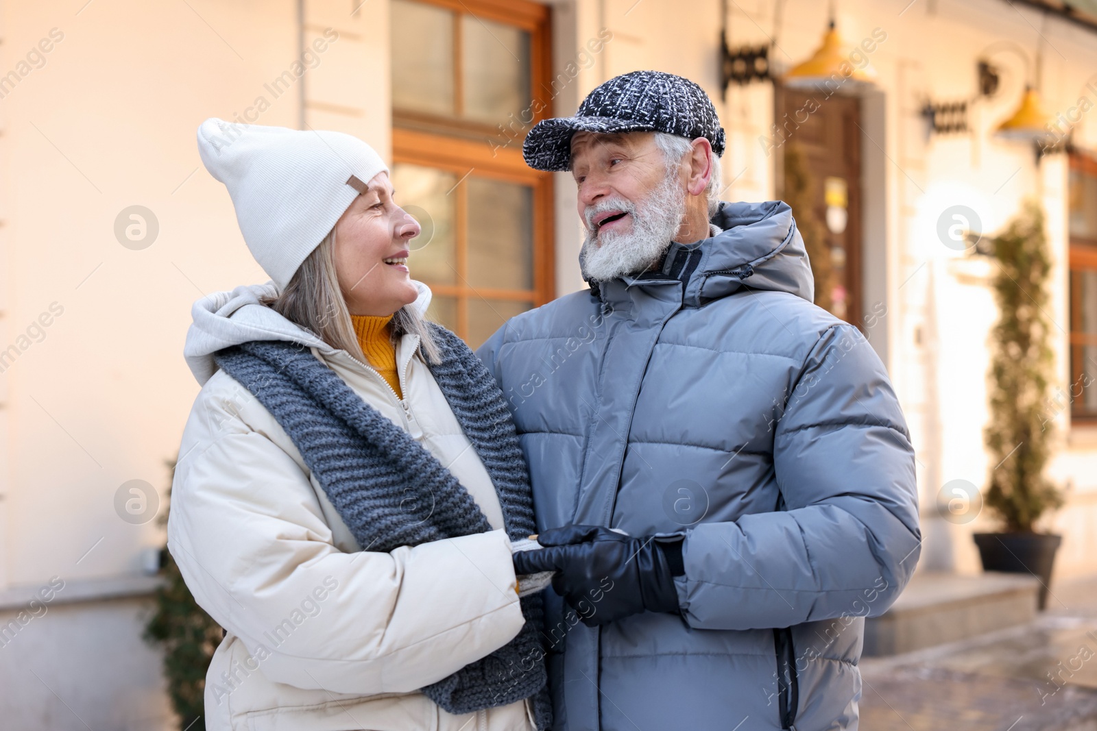 Photo of Happy elderly couple together on city street