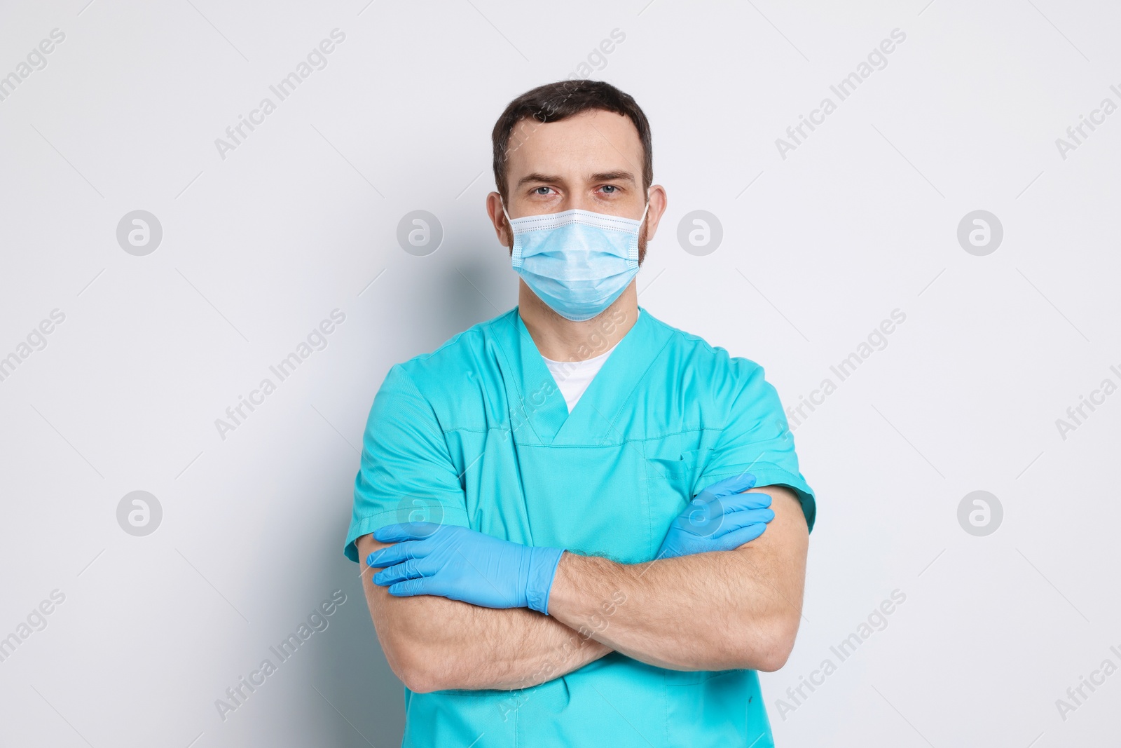 Photo of Portrait of professional dentist on light background