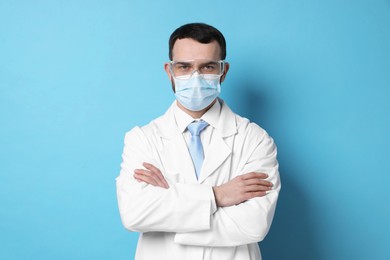 Photo of Portrait of professional dentist on light blue background